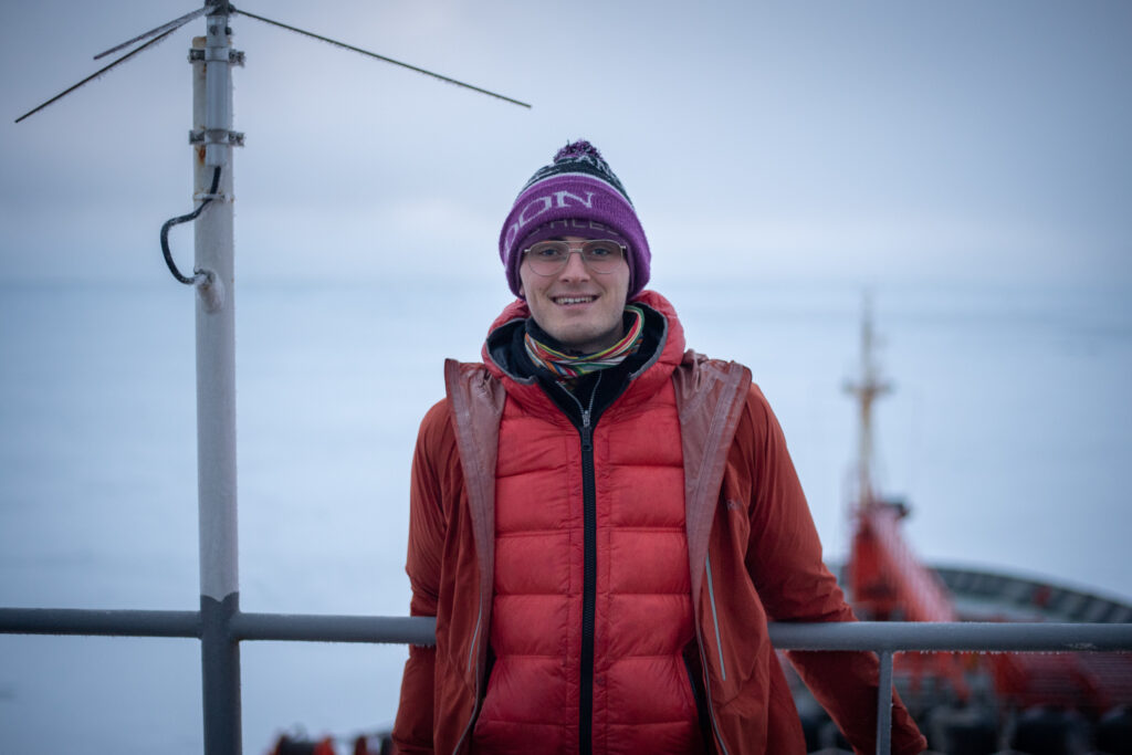 Robbie Mallett on a ship in the Arctic Ocean