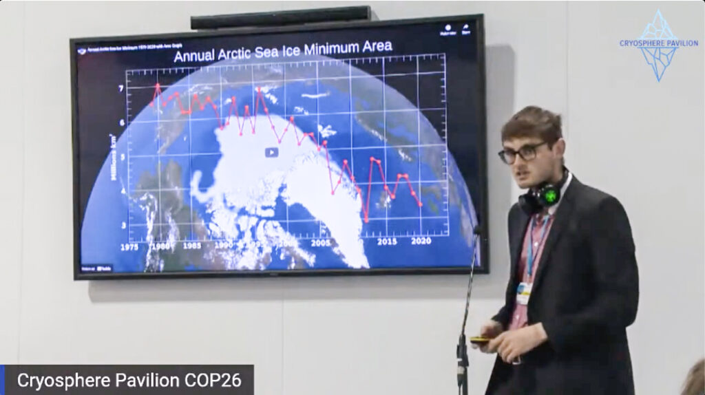 Robbie Mallett presents a slide showing a timeseries of Arctic sea ice decline at COP26